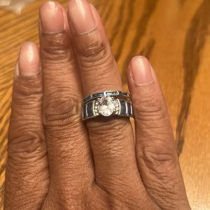 NWOT BLUE & FAUX DIAMOND CENTER STONE AND SILVERTONE 2PC WEDDING/ENGAGEMENT SET.